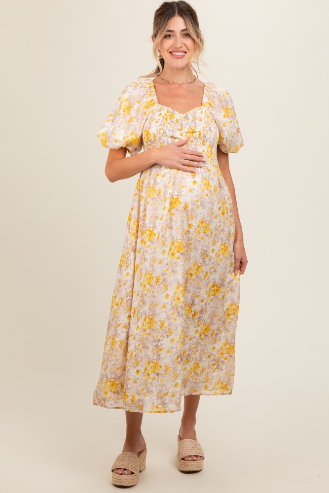 yellow floral smocked sweetheart neck short puff sleeve maternity midi dress