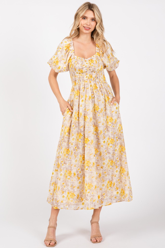 yellow floral smocked sweetheart neck short puff sleeve midi dress