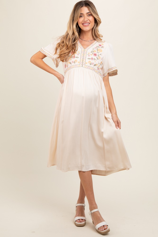 cream short sleeve v-neck maternity midi dress