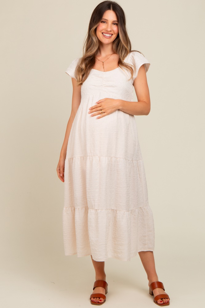 ivory textured sweetheart neck short puff sleeve tiered maternity midi dress