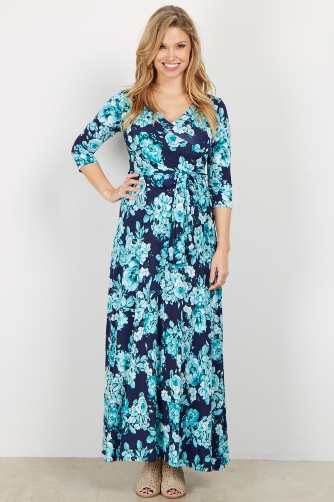A floral printed maxi dress. V-neckline. Perfect for nursing after pregnancy. Cinched under bust. Sash tie. 3/4 sleeves.