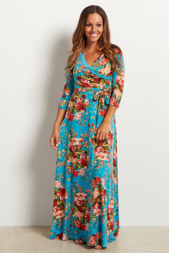 A floral print maxi dress. V-neckline. Perfect for nursing after pregnancy. Cinched under bust. Sash tie. 3/4 sleeves.